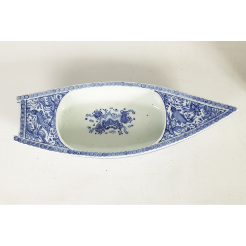 140 - A 19TH CENTURY CHINESE BLUE AND WHITE PORCELAIN BOAT-SHAPED DISH the top decorated with carp amongst... 