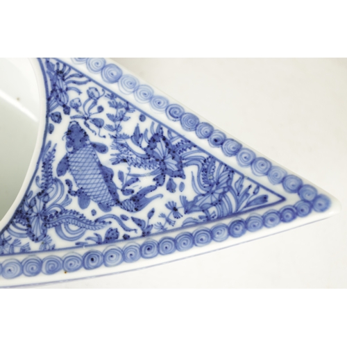 140 - A 19TH CENTURY CHINESE BLUE AND WHITE PORCELAIN BOAT-SHAPED DISH the top decorated with carp amongst... 