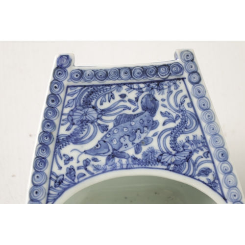 140 - A 19TH CENTURY CHINESE BLUE AND WHITE PORCELAIN BOAT-SHAPED DISH the top decorated with carp amongst... 