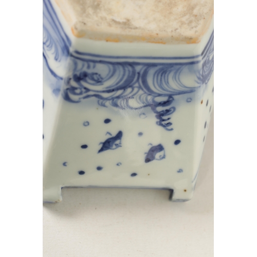 140 - A 19TH CENTURY CHINESE BLUE AND WHITE PORCELAIN BOAT-SHAPED DISH the top decorated with carp amongst... 