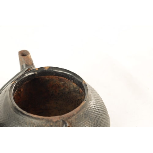 148 - TWO MEIJI PERIOD JAPANESE CAST IRON KETTLES both of squat bulbous form with textured decoration and ... 