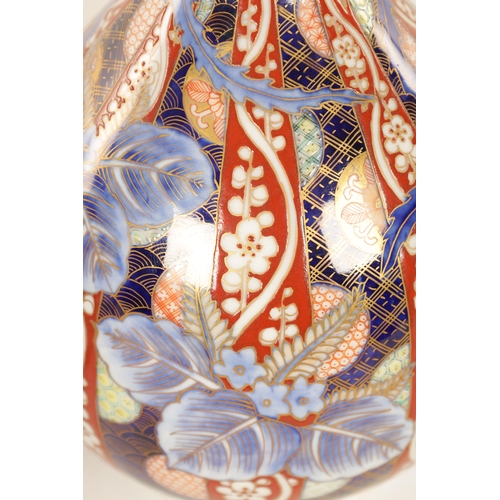 151 - A MEIJI PERIOD JAPANESE BOTTLENECK FUKAGUWA VASE painted with a stylised bird amongst decorative pan... 