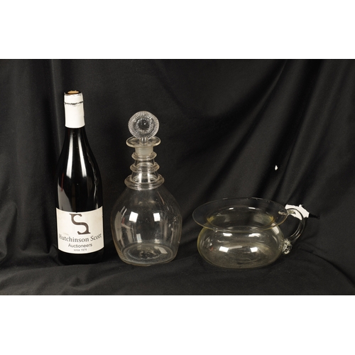 16 - AN UNUSUAL GEORGIAN GLASS SPITTOON AND BRANDY DECANTER the spittoon with a broad rim, rounded body a... 