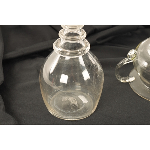 16 - AN UNUSUAL GEORGIAN GLASS SPITTOON AND BRANDY DECANTER the spittoon with a broad rim, rounded body a... 