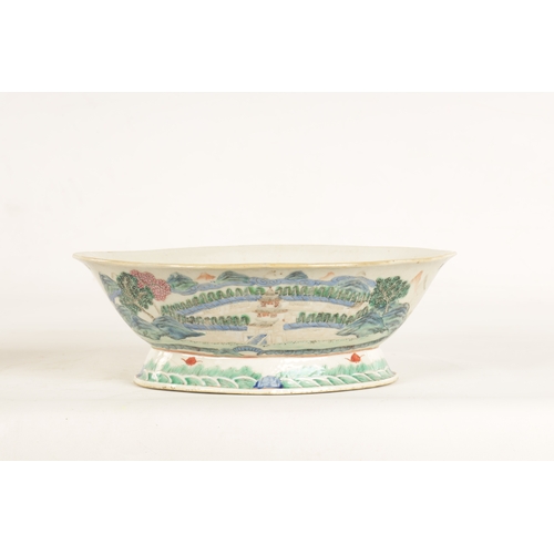 168 - A 19TH CENTURY CHINESE PORCELAIN DISH ON HARDWOOD STAND decorated with landscape views of a palace b... 