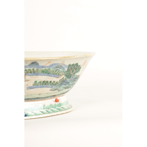 168 - A 19TH CENTURY CHINESE PORCELAIN DISH ON HARDWOOD STAND decorated with landscape views of a palace b... 