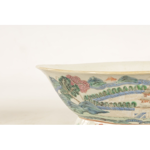 168 - A 19TH CENTURY CHINESE PORCELAIN DISH ON HARDWOOD STAND decorated with landscape views of a palace b... 