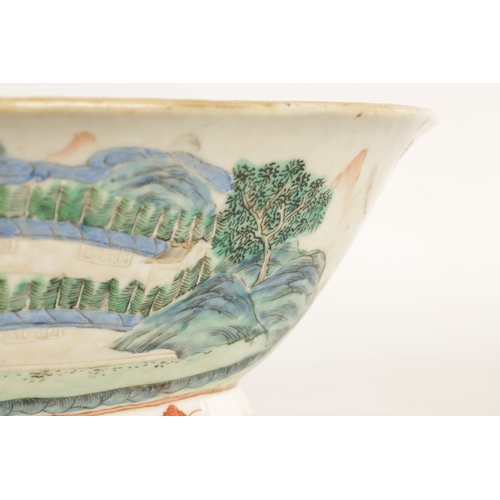 168 - A 19TH CENTURY CHINESE PORCELAIN DISH ON HARDWOOD STAND decorated with landscape views of a palace b... 