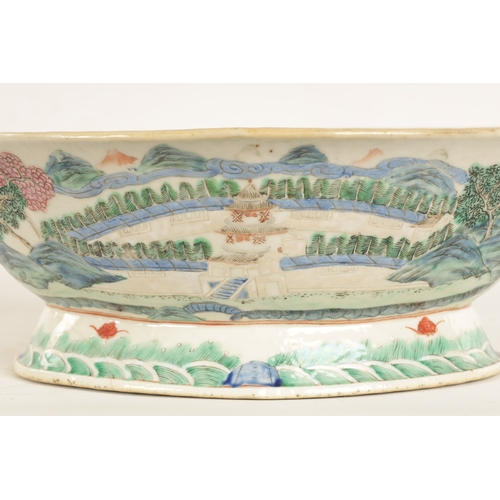 168 - A 19TH CENTURY CHINESE PORCELAIN DISH ON HARDWOOD STAND decorated with landscape views of a palace b... 