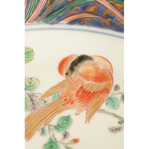 191 - A LATE 19TH CENTURY IMARI LARGE SHALLOW DISH the coloured foliated border with dragon mask head pane... 