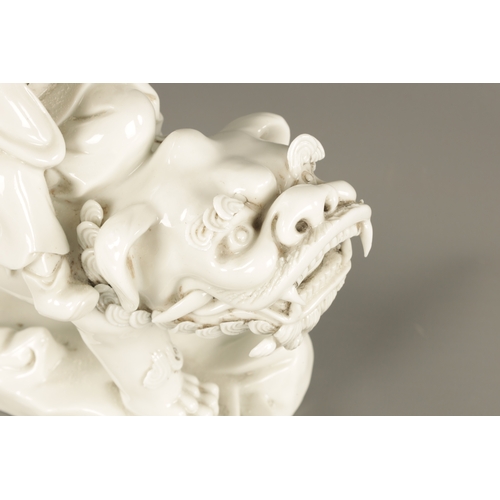 227 - A CHINESE BLANC-DE-CHINE PORCELAIN FIGURE Modelled as Li Tieguai holding his crutch with double gour... 
