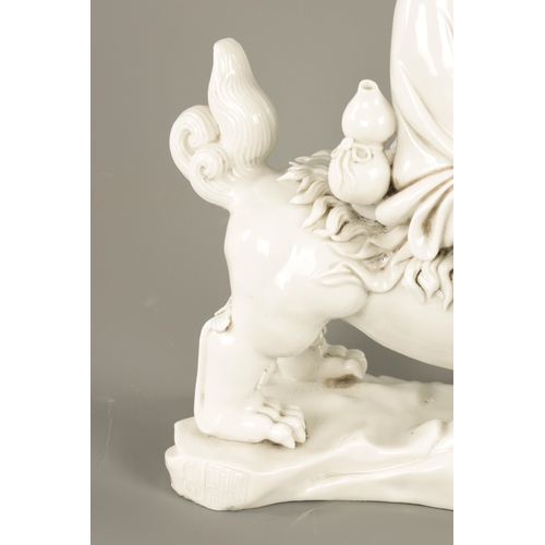 227 - A CHINESE BLANC-DE-CHINE PORCELAIN FIGURE Modelled as Li Tieguai holding his crutch with double gour... 