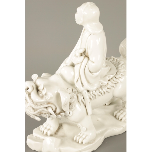 227 - A CHINESE BLANC-DE-CHINE PORCELAIN FIGURE Modelled as Li Tieguai holding his crutch with double gour... 