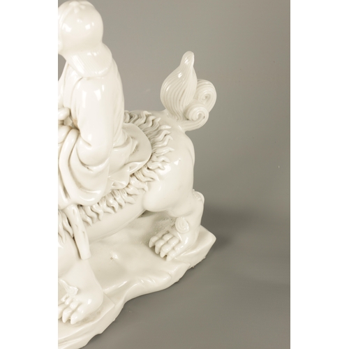 227 - A CHINESE BLANC-DE-CHINE PORCELAIN FIGURE Modelled as Li Tieguai holding his crutch with double gour... 