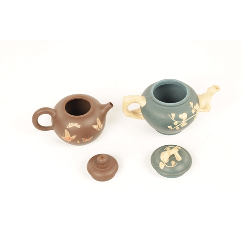 260 - TWO 19TH CENTURY CHINESE TERRACOTTA SMALL TEAPOTS the blue example with branch work handles and spou... 