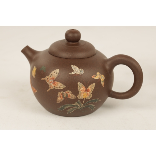 260 - TWO 19TH CENTURY CHINESE TERRACOTTA SMALL TEAPOTS the blue example with branch work handles and spou... 