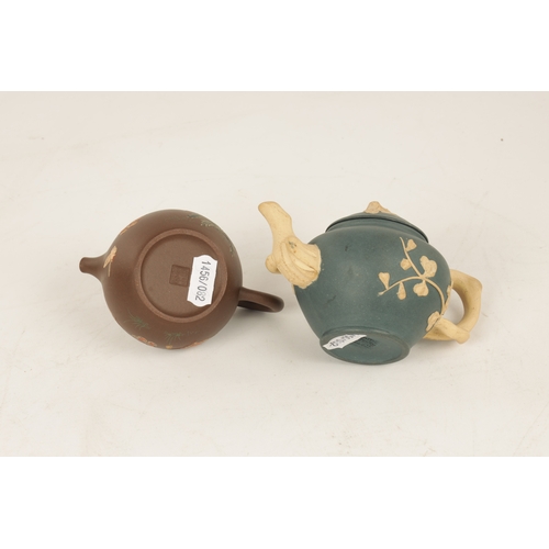 260 - TWO 19TH CENTURY CHINESE TERRACOTTA SMALL TEAPOTS the blue example with branch work handles and spou... 