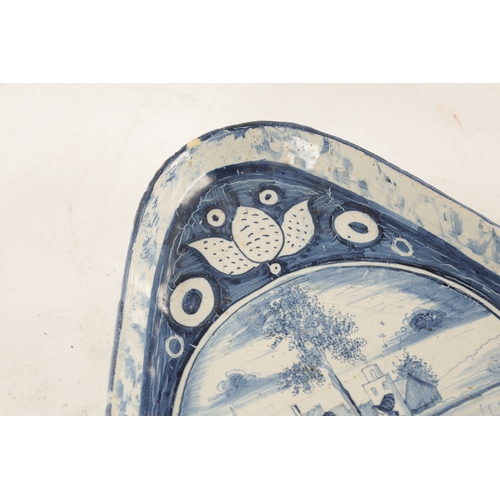 31 - AN 18TH/EARLY 19TH CENTURY DELFT/FAIENCE TRIANGULAR SHALLOW DISH with figural landscape centre, flor... 
