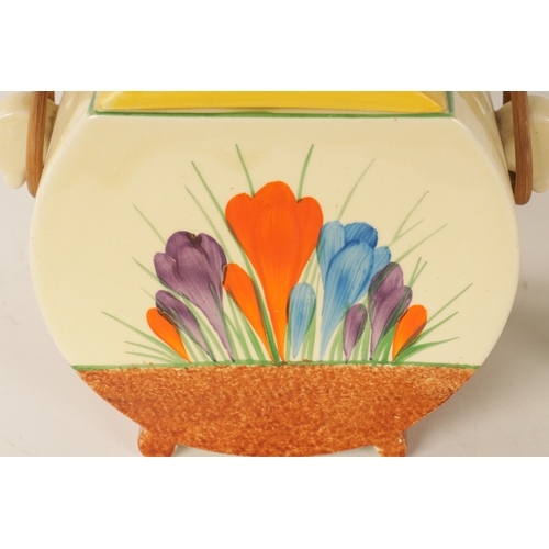 45 - A COLLECTION OF CLARICE CLIFF “CROCUS” PATTERN POTTERY comprising a biscuit barrel, three cups, one ... 