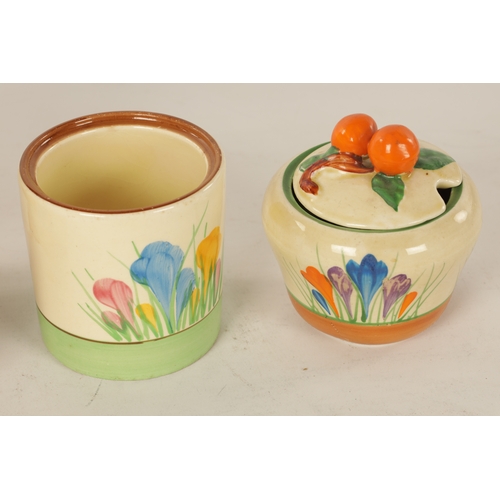 45 - A COLLECTION OF CLARICE CLIFF “CROCUS” PATTERN POTTERY comprising a biscuit barrel, three cups, one ... 