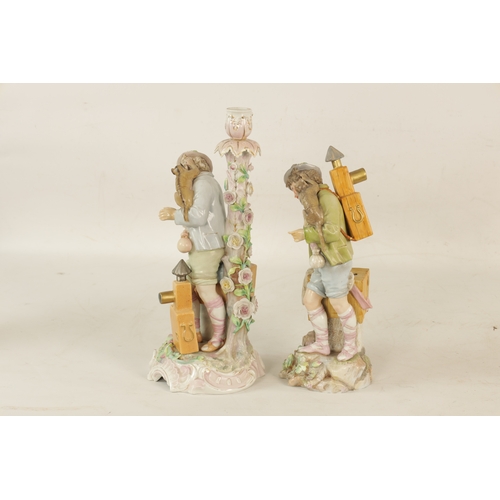 51 - TWO LATE 19TH-CENTURY DRESDEN-TYPE PORCELAIN FIGURINES both modelled as a standing boy with a monkey... 