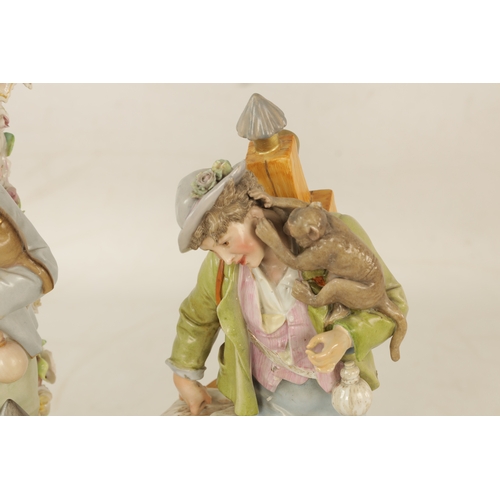 51 - TWO LATE 19TH-CENTURY DRESDEN-TYPE PORCELAIN FIGURINES both modelled as a standing boy with a monkey... 