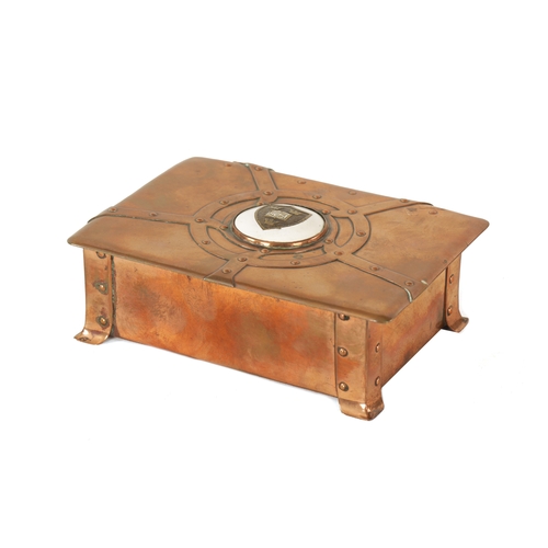 542 - AN ART NOUVEAU A.E.JONES COPPER AND ENAMEL LIDDED BOX having strap rivet work design and centred by ... 