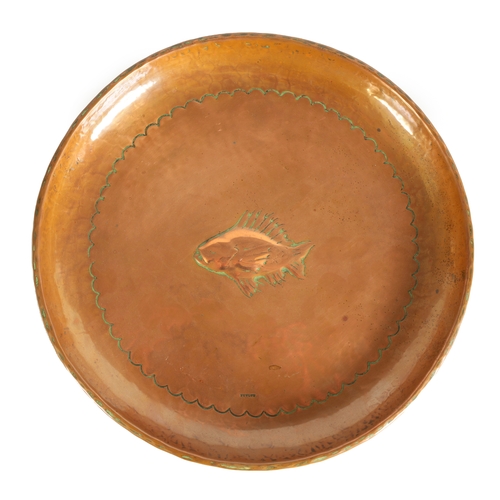 544 - AN ARTS AND CRAFTS COPPER NEWLYN SCHOOL WALL PLAQUE of dished form with planished design, embossed f... 