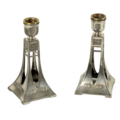 548 - A PAIR OF EARLY 20TH CENTURY WMF SECESSIONIST SILVER PLATED CANDLESTICKS of flared tapering form wit... 