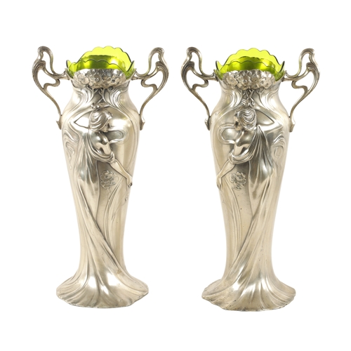 557 - A STYLISH LARGE PAIR OF ART NOUVEAU WMF PEWTER VASES WITH GREEN GLASS LINERS the petal shaped bases ... 
