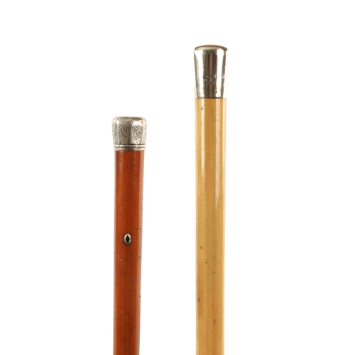 561 - TWO LATE 19TH CENTURY SILVER MOUNTED WALKING STICKS with malacca canes. (92cm and 80cm long)