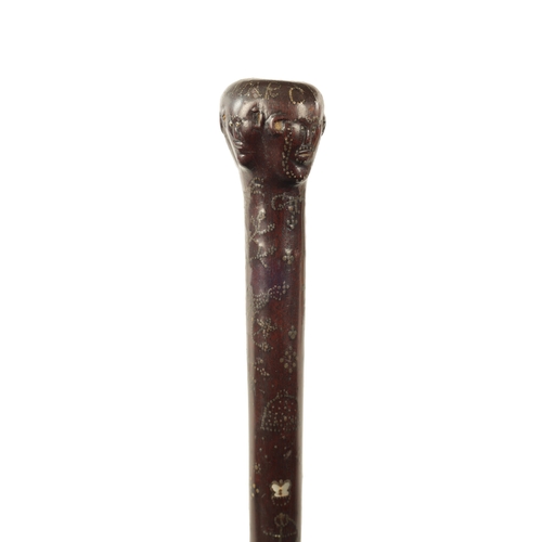 570 - A GOOD MID-19TH CENTURY FOLK ART MARRIAGE WALKING STICK inlaid with brass stud work and mother-of-pe... 