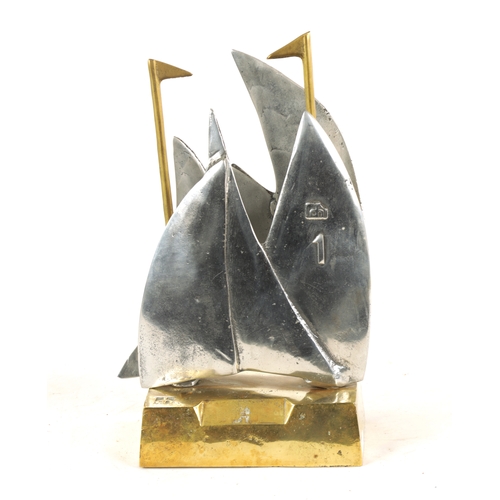 588 - A STYLISH BRONZE AND STEEL MARITIME SCULPTURE, possibly a racing trophy, modelled as sailing boats w... 