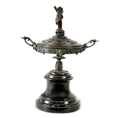 593 - A 19TH CENTURY BRONZE LIDDED TAZZA with figural finial and stylised floral decoration, raised on a g... 