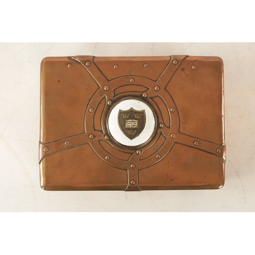 542 - AN ART NOUVEAU A.E.JONES COPPER AND ENAMEL LIDDED BOX having strap rivet work design and centred by ... 