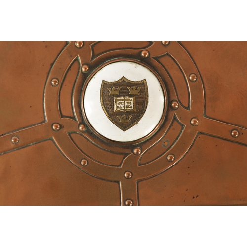 542 - AN ART NOUVEAU A.E.JONES COPPER AND ENAMEL LIDDED BOX having strap rivet work design and centred by ... 