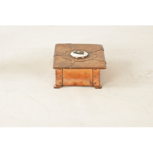 542 - AN ART NOUVEAU A.E.JONES COPPER AND ENAMEL LIDDED BOX having strap rivet work design and centred by ... 