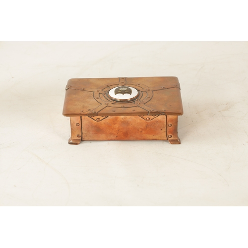542 - AN ART NOUVEAU A.E.JONES COPPER AND ENAMEL LIDDED BOX having strap rivet work design and centred by ... 