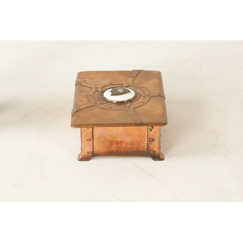 542 - AN ART NOUVEAU A.E.JONES COPPER AND ENAMEL LIDDED BOX having strap rivet work design and centred by ... 
