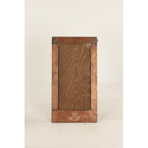 543 - AN ARTS AND CRAFTS COPPER FRAMED PICTURE FRAME IN THE LIBERTYS STYLE bearing military motif. (36.5cm... 