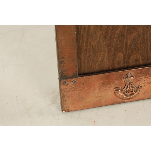 543 - AN ARTS AND CRAFTS COPPER FRAMED PICTURE FRAME IN THE LIBERTYS STYLE bearing military motif. (36.5cm... 