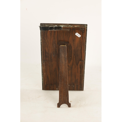 543 - AN ARTS AND CRAFTS COPPER FRAMED PICTURE FRAME IN THE LIBERTYS STYLE bearing military motif. (36.5cm... 