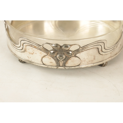 546 - A STYLISH ART NOUVEAU WMF LIBERTY'S-STYLE POLISHED PEWTER AND GLASS LINED DISH the glass dish with l... 