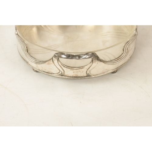 546 - A STYLISH ART NOUVEAU WMF LIBERTY'S-STYLE POLISHED PEWTER AND GLASS LINED DISH the glass dish with l... 