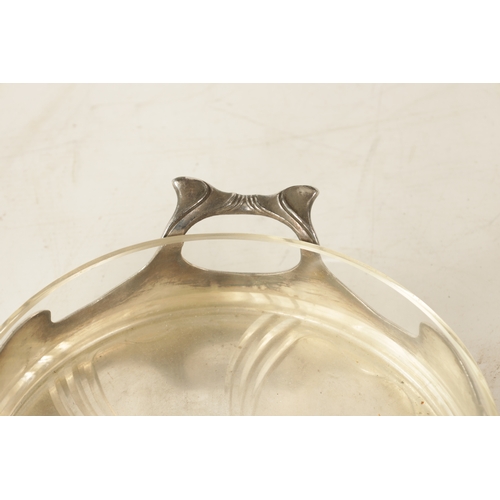 546 - A STYLISH ART NOUVEAU WMF LIBERTY'S-STYLE POLISHED PEWTER AND GLASS LINED DISH the glass dish with l... 