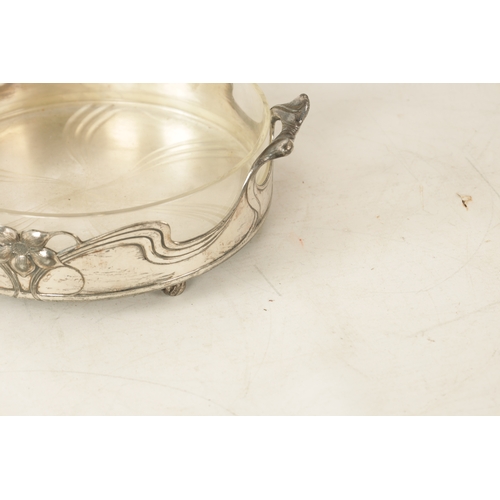 546 - A STYLISH ART NOUVEAU WMF LIBERTY'S-STYLE POLISHED PEWTER AND GLASS LINED DISH the glass dish with l... 