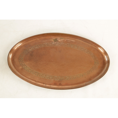 550 - AN ARTS AND CRAFTS OVAL PLENISHED COPPER TRAY with leaf and berry engraved inner border. (51cm wide ... 