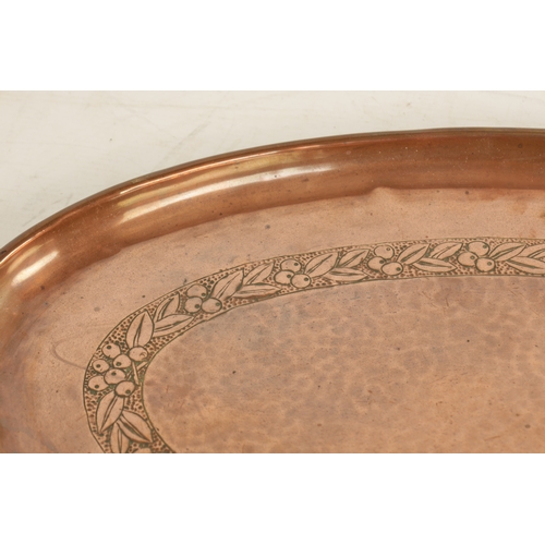 550 - AN ARTS AND CRAFTS OVAL PLENISHED COPPER TRAY with leaf and berry engraved inner border. (51cm wide ... 