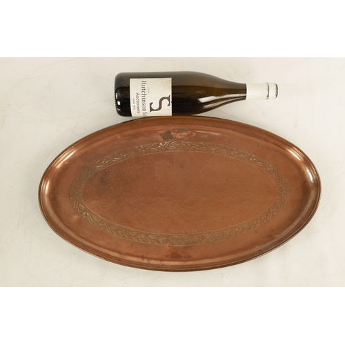 550 - AN ARTS AND CRAFTS OVAL PLENISHED COPPER TRAY with leaf and berry engraved inner border. (51cm wide ... 