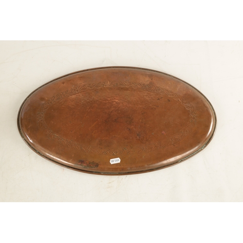 550 - AN ARTS AND CRAFTS OVAL PLENISHED COPPER TRAY with leaf and berry engraved inner border. (51cm wide ... 